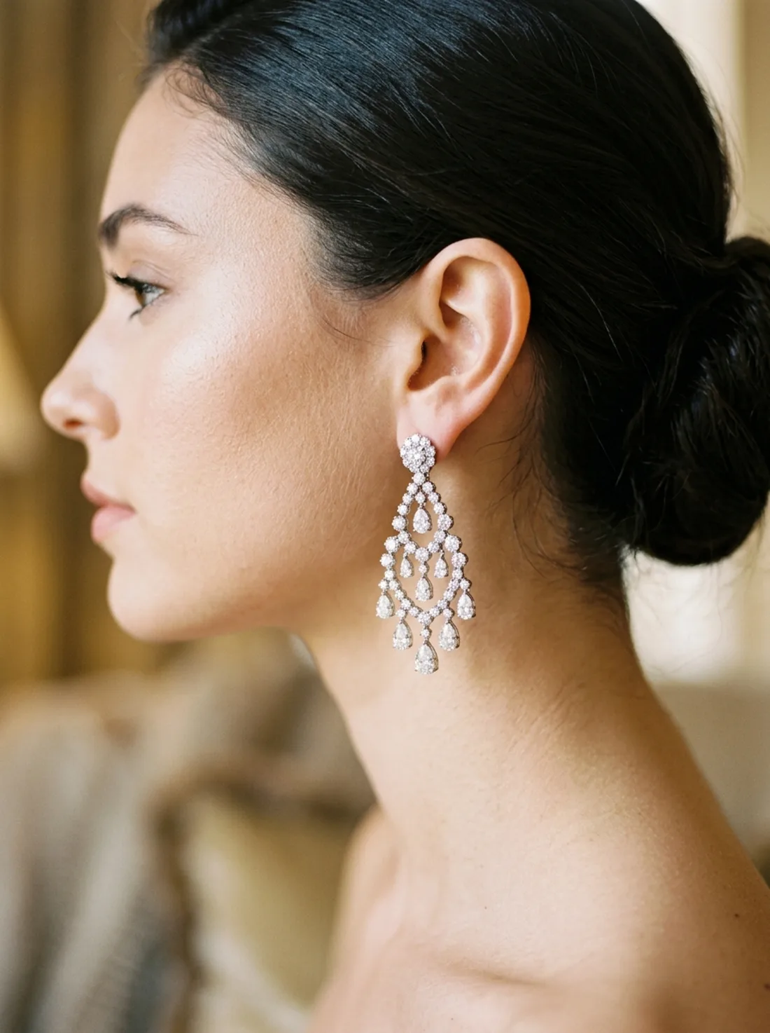 Diamond drop earrings worn in profile